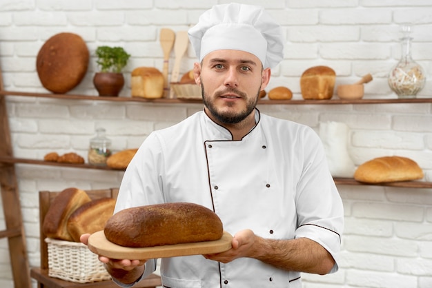 Young man working at his bakery