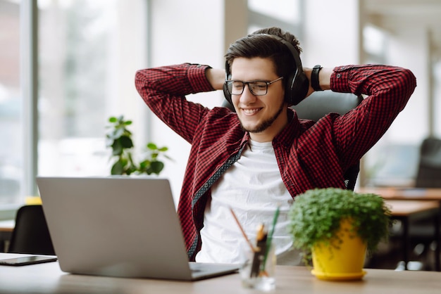 Young man working on laptop Education and working online Freelancer technology remote job