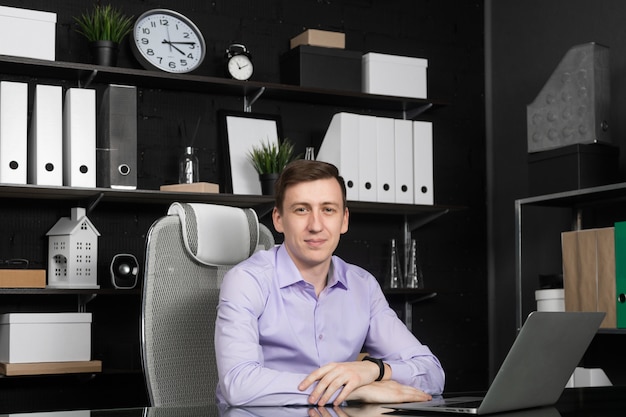 Young man working on laptop in the office