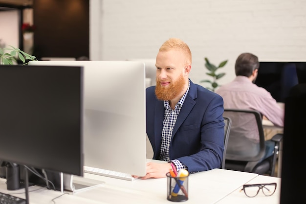 Young man working in modern office