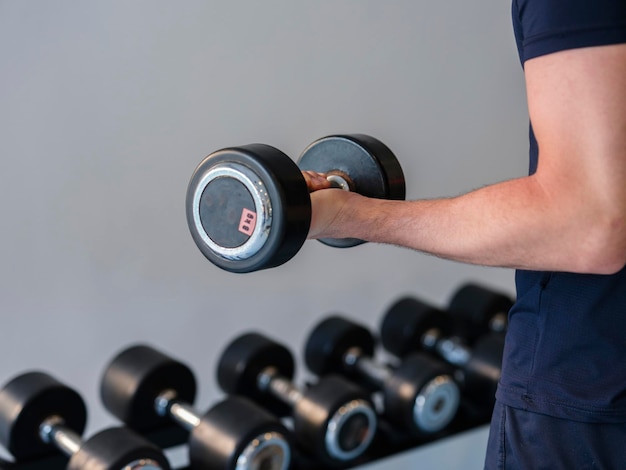 A young man working out weights at the gym