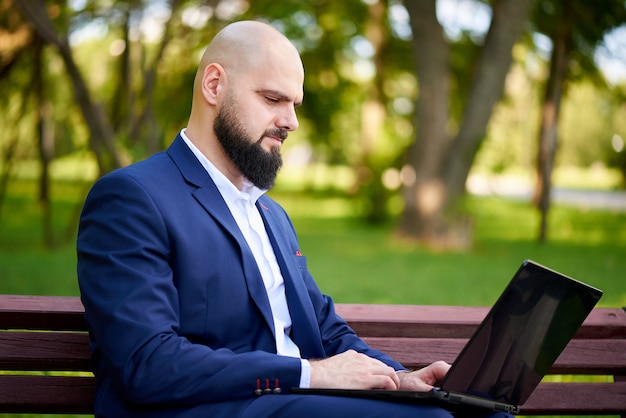 A young man working in the park