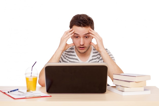 Young man working with a laptop