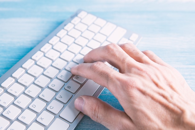 Young man works with computer