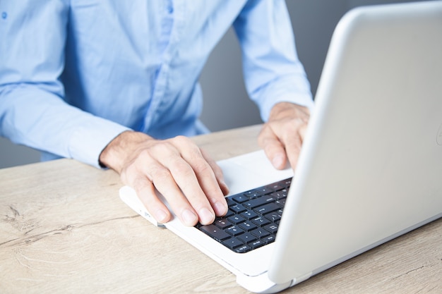 Young man works with computer