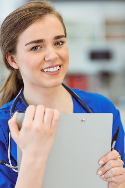 Young medical student smiling at camera