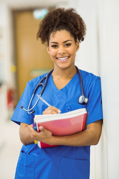 Young medical student taking notes