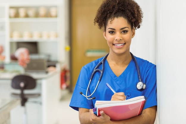 Young medical student taking notes