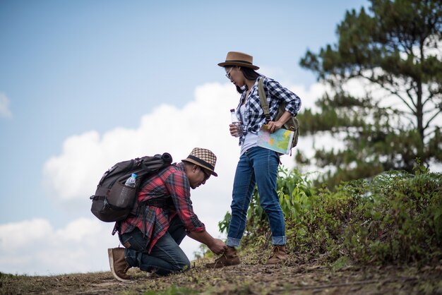 Young men are tying shoes to lover in the  forest