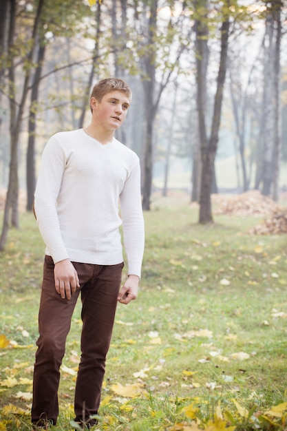 Young men in autumn park