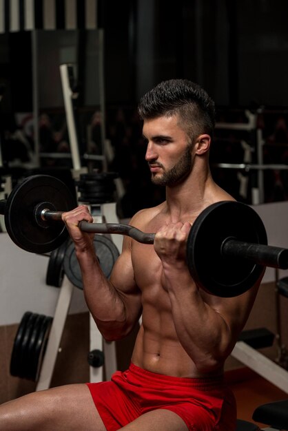 Young Men Doing Exercise For Biceps