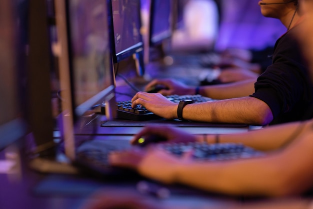 Young men playing online games at competition