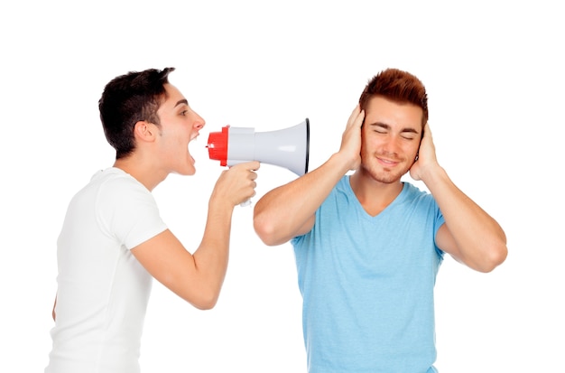 Young men screams to his friend through a megaphone