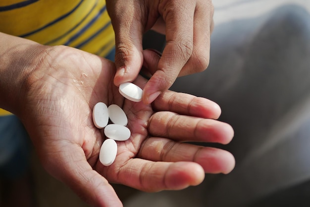 Young men taking medical pill