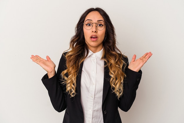 Young mexican business woman isolated on white background surprised and shocked.