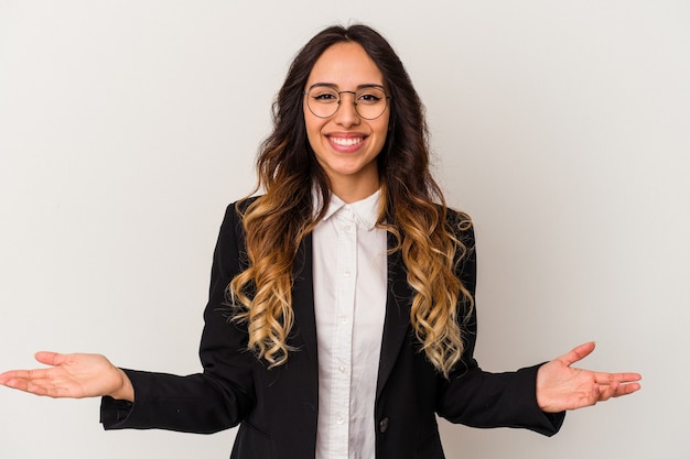 Young mexican business woman isolated on white showing a welcome expression.