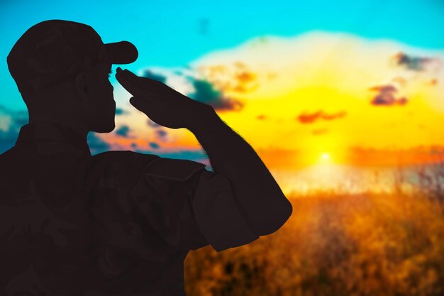 Photo young military soldier man silhouette on background