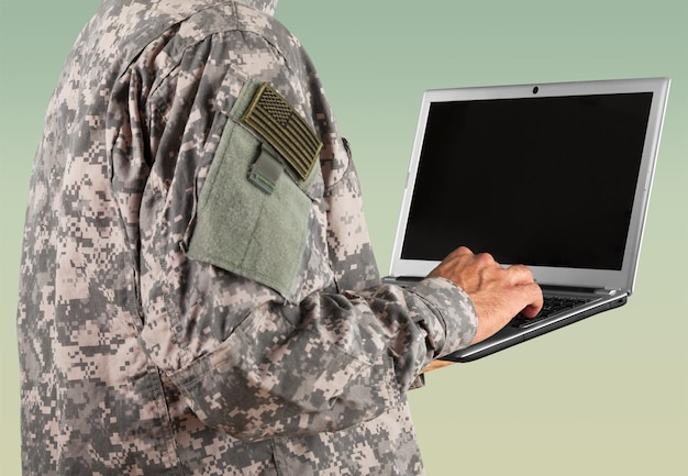 Young military soldier man using laptop