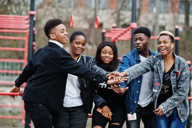 Young millennials african friends on outdoor gym. happy black\
people having fun together. generation z friendship concept.