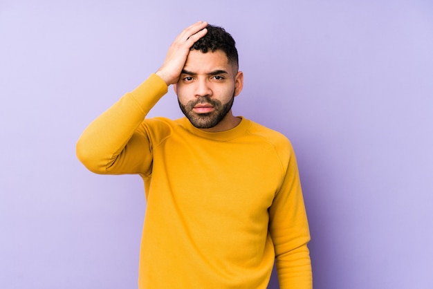 Young mixed race arabic man tired and very sleepy keeping hand on head.