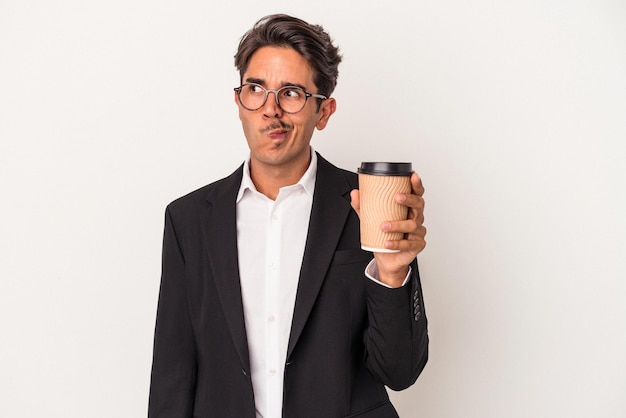 Young mixed race business man holding take away coffee  isolated on white background confused, feels doubtful and unsure.