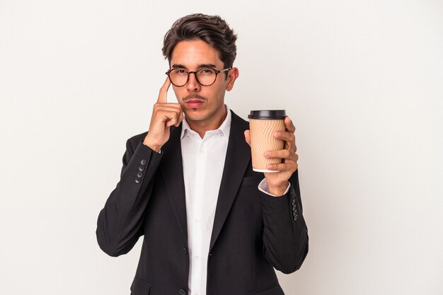 Young mixed race business man holding take away coffee  isolated on white background pointing temple with finger, thinking, focused on a task.