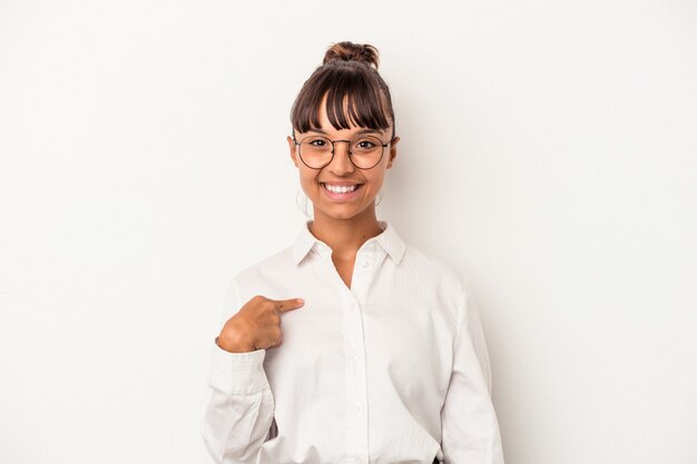 Young mixed race business woman isolated on white background  person pointing by hand to a shirt copy space, proud and confident