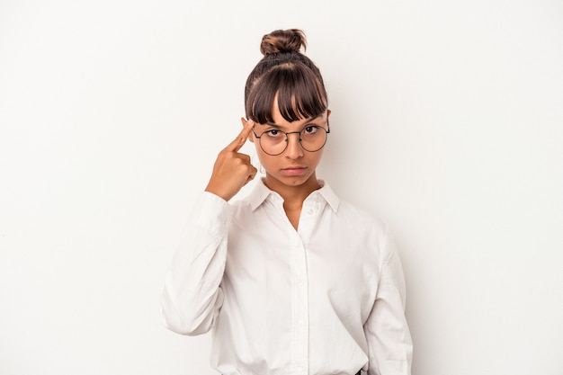 Young mixed race business woman isolated on white background  pointing temple with finger, thinking, focused on a task.