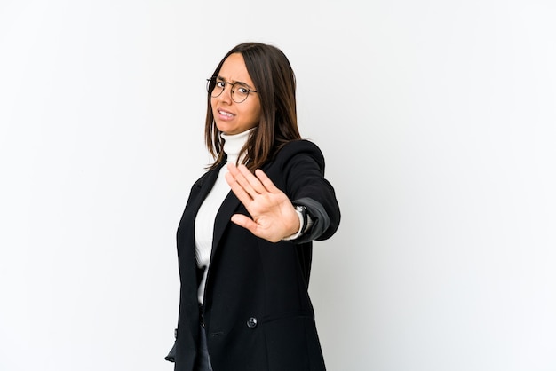 Young mixed race business woman isolated on white background rejecting someone showing a gesture of disgust.