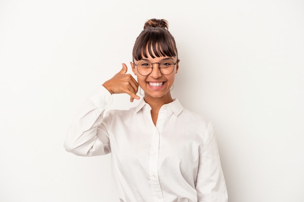 Young mixed race business woman isolated on white background  showing a mobile phone call gesture with fingers.