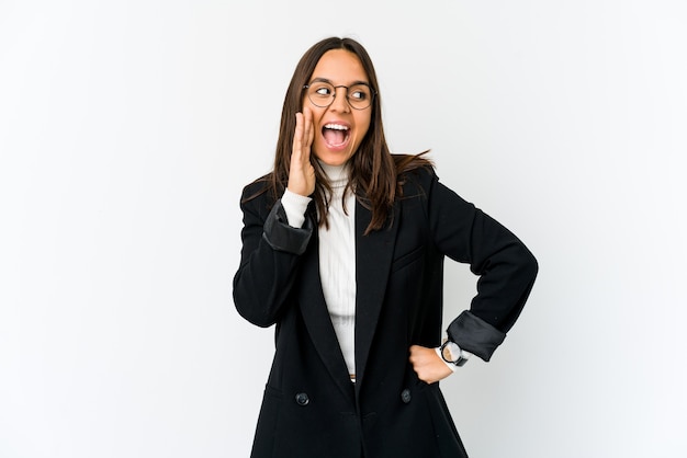 Young mixed race business woman shouting excited to front.