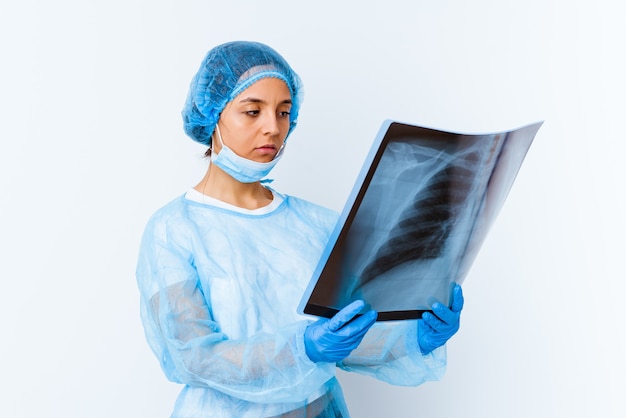 Young mixed race doctor woman holding a bone scan isolated