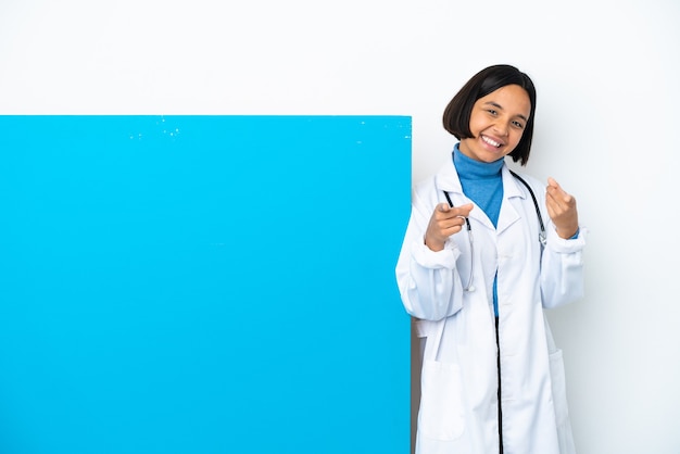 Young mixed race doctor woman with a big placard isolated pointing front with happy expression