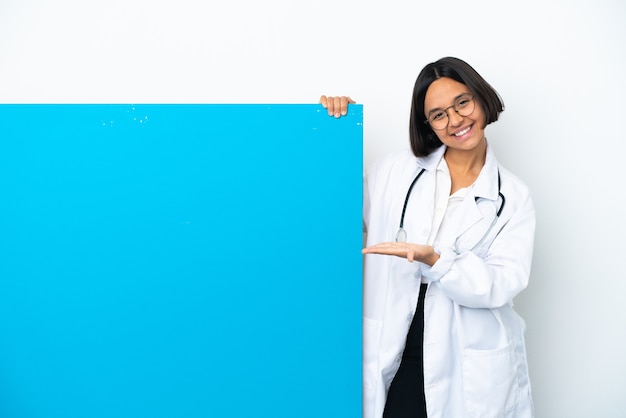 Young mixed race doctor woman with a big placard isolated on white background extending hands to the side for inviting to come