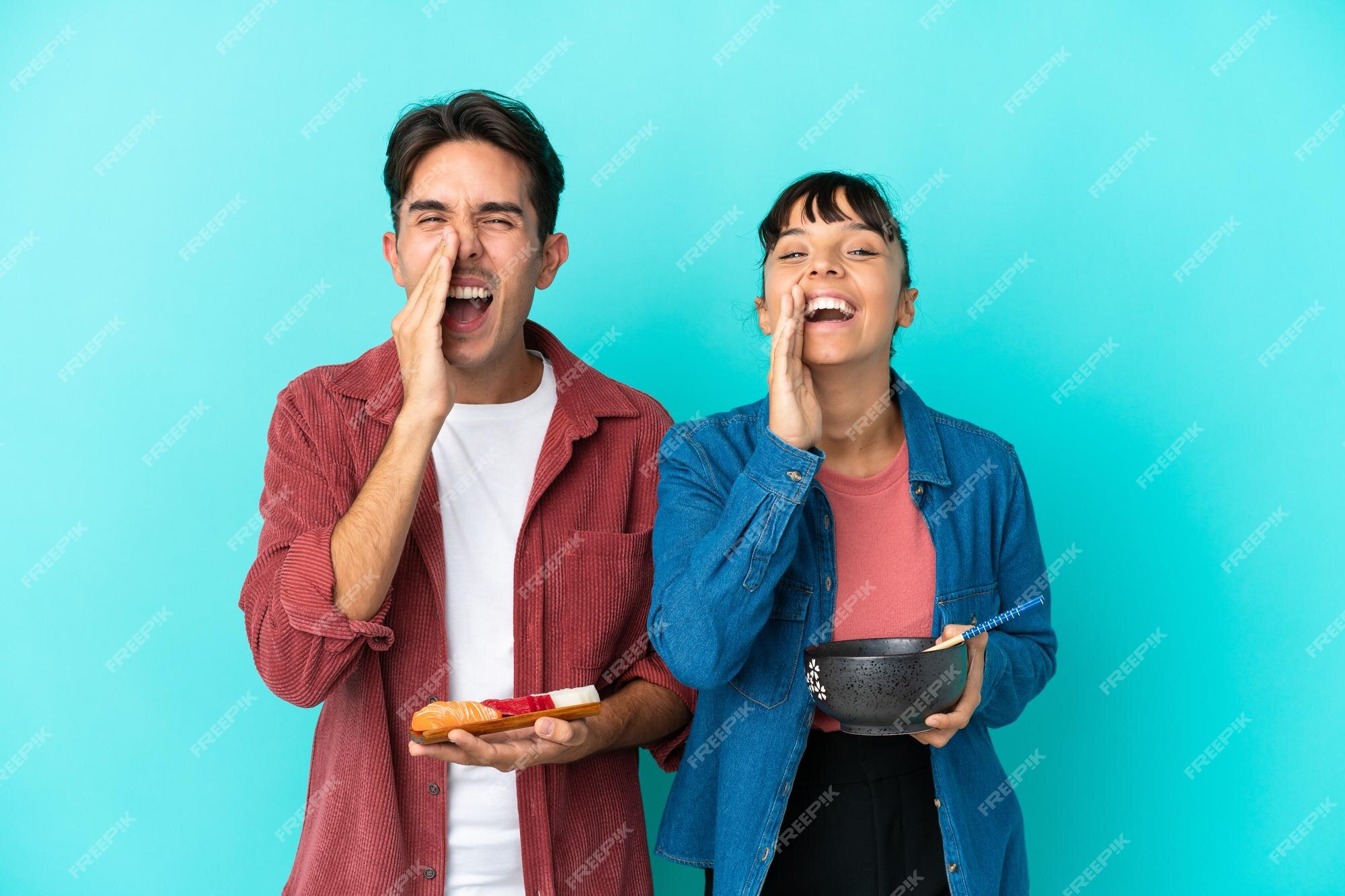 Premium Photo | Young mixed race friends holding sashimi and ramen ...