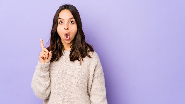 Young mixed race hispanic woman isolated having an idea, inspiration concept