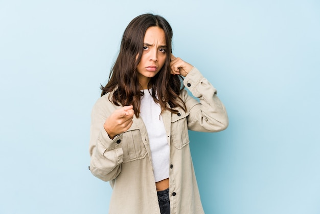 Young mixed race hispanic woman isolated pointing temple with finger, thinking, focused on a task.