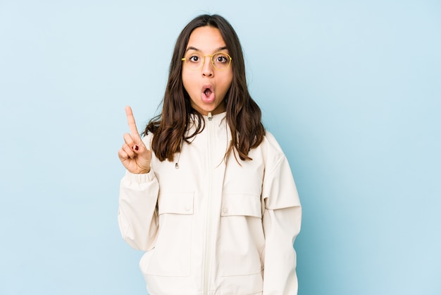 Young mixed race hispanic woman isolated pointing upside with opened mouth.