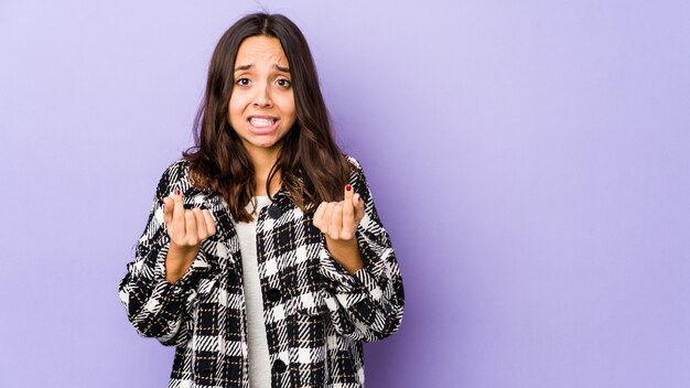 Young mixed race hispanic woman isolated showing that she has no money.