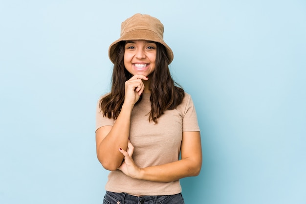 Young mixed race hispanic woman isolated smiling happy and confident, touching chin with hand.