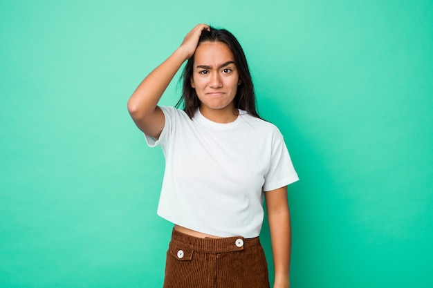 Young mixed race indian woman isolated being shocked