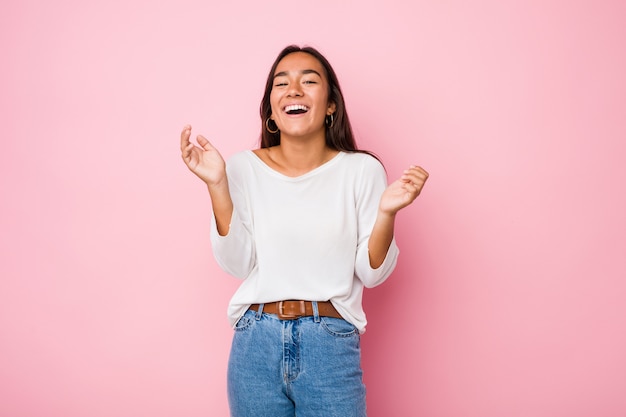 Young mixed race indian woman joyful laughing a lot. Happiness concept.