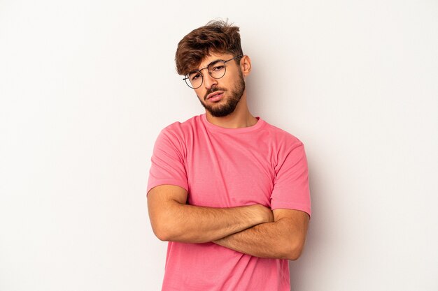 Young mixed race man isolated on grey background who is bored, fatigued and need a relax day.