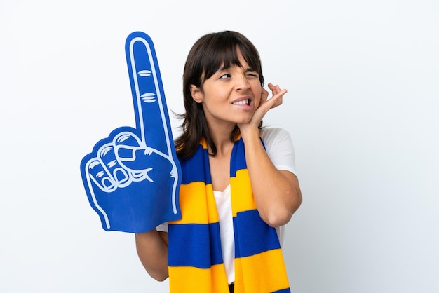 Young mixed race sports fan woman isolated on white background frustrated and covering ears