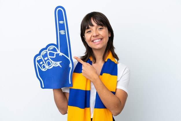 Young mixed race sports fan woman isolated on white background pointing to the side to present a product