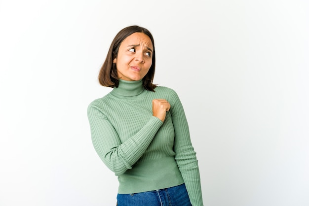 Young mixed race woman confused, feels doubtful and unsure.