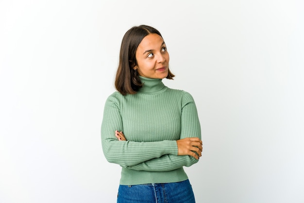 Young mixed race woman dreaming of achieving goals and purposes