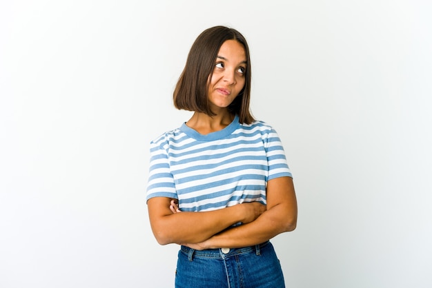 Young mixed race woman dreaming of achieving goals and purposes