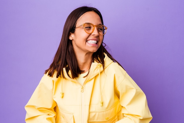 Young mixed race woman isolated laughs and closes eyes, feels relaxed and happy.