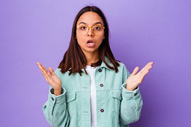 Young mixed race woman isolated surprised and shocked.